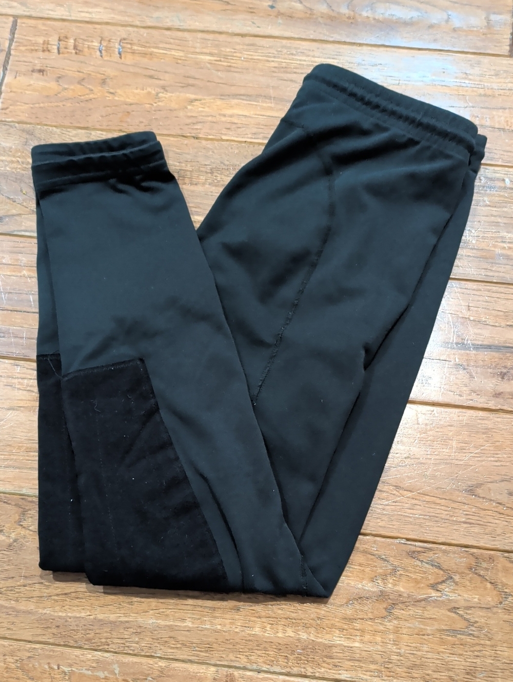 Kerrits Youth Black Equestrian Leggings with Small Orange Logo Accent